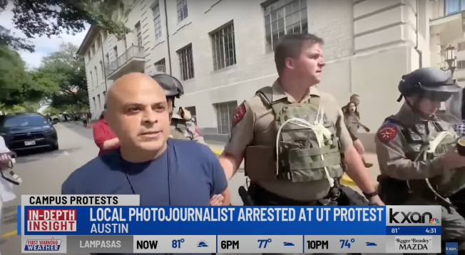 FOX 7 Austin photojournalist Carlos Sanchez arrested and being led away by authorities on April 24. (Photo: KXAN/YouTube)